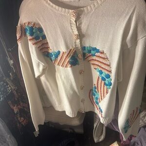 Embroidered White Sweater with Blue and Red Accents